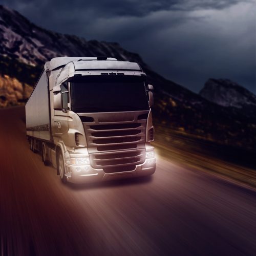 gray-truck-highway-road-night-time-min
